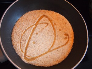 The bread crumbs shown with 1 tbsp of Extra Virgin Olive Oil. Mix the bread crumbs well making sure they get coated. The color of the crumbs will stay the same and the addition of the oil helps the texture and the browning. The next photo shows the finished toasting color.