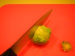 Score the brussel sprout with a cross.
