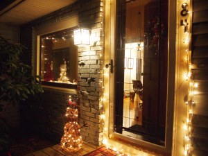 the house lit up from the side of the porch