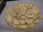 place the potato slices around and atop one another in a flower pattern