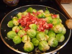 In a pan on medium-high heat add oil, shallots, Brussels Sprouts and chopped pancetta