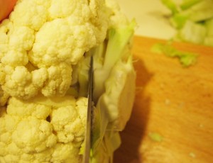Trimming the cauliflower stem and leaves