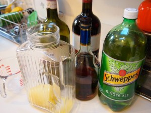 Here I have a cup of frozen orange juice in the glass carafe, surrounded by all the ingredients we need.