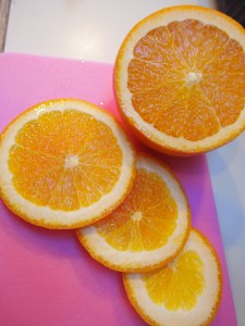 Winter fruits are a tough one, but Oranges are actually warm weather's winter fruit!  So we washed a ripe navel orange, which smelled amazing when we cut it open, and sliced it up thin; then added it to the wine.  