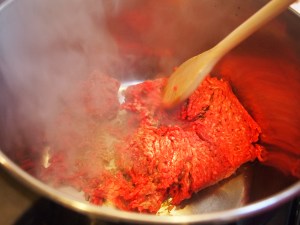 Brown meat over medium heat.  Breaking down the beef with a spoon until into finer pieces
