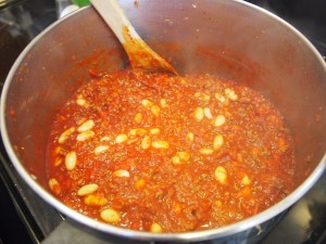 Adding in white beans. you can use any type of pinto bean; white is a fun alternative