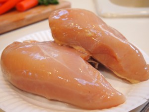 2 bone in breasts of chicken cleaned my way.  Washed in hot water,  trimmed (skin and fats taken off), then scrubbed with kosher salt then rinsed with cool water.  this process helps with the skimming of the soup later.