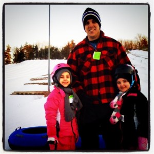 My husband with the two girls.  You know he is all New England cause there is no scarf!