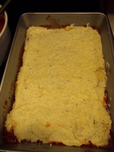 Using a spatula (or back of a spoon) spread the ricotta mixture over the dry pasta, then top with a layer of sauce.