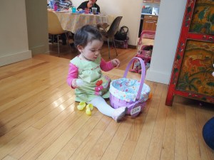 Our niece curious about her  basket of eggs.