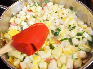 Add in a half can of tomato paste to a boiling pot.
