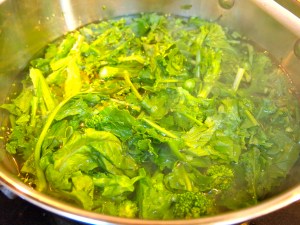 Boil the broccoli rabe to remove the bitterness.