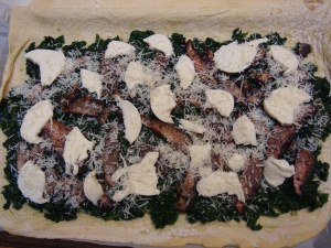 Shown with all the ingredients together. Now fold over the dough, crimping the outer edges (adding olive oil on the edge between the two layers).