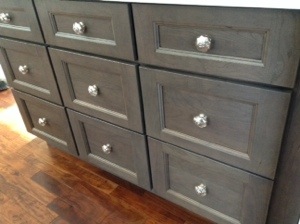 We went with a gray washed cherry cabinet here.  To break up the space and to define it as a dining china cabinet.  