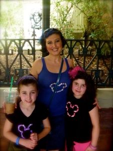 My girls and I waiting on The Haunted Mansion.. my fav ride at the park!