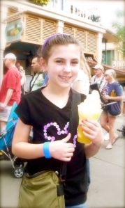 Eating a yummay Dole Whip float.  She ate the whole thing alone..not even a sip of pineapple fer her mamma :\